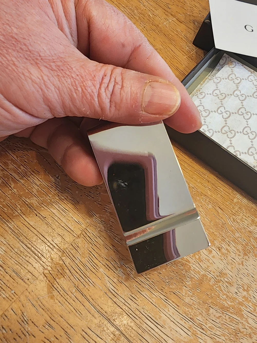 Gucci Diamante money clip featuring the signature diamond pattern and engraved